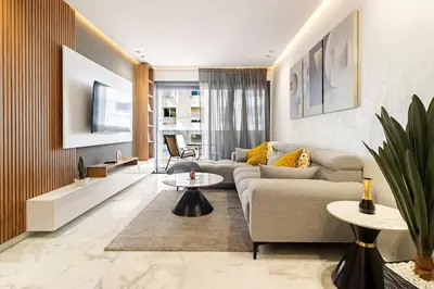 a living room with a couch and a table at Appartement de luxe sur la Corniche in Casablanca