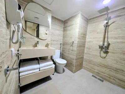 a bathroom with a sink and a toilet at Comfort & Elegance, Station and Tram Access in Casablanca