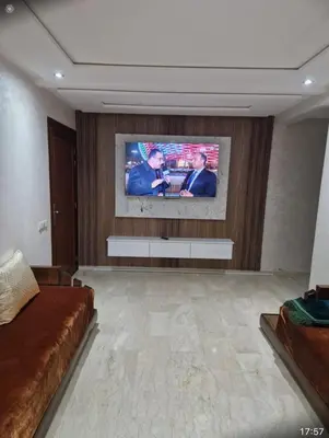 a living room with a flat screen tv on a wall at T3 confort Casablanca in Casablanca