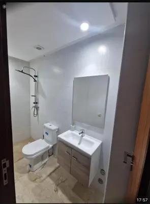 a bathroom with a sink and a toilet and a mirror at T3 confort Casablanca in Casablanca