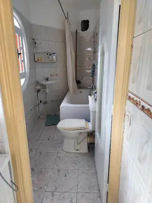 a small bathroom with a toilet and a sink at Val Fleurie in Casablanca