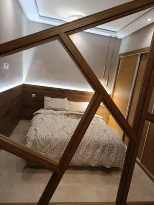 a view through a glass window of a bed at Nice studio for rent in Casablanca