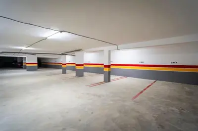 an empty parking garage with red yellow and white walls at Chic Studio I Anfa Park & CFC I Gym Wifi & Parking in Casablanca