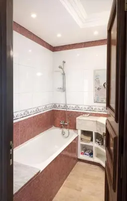 a bathroom with a tub and a sink at High Standing Apartment in Casablanca in Casablanca