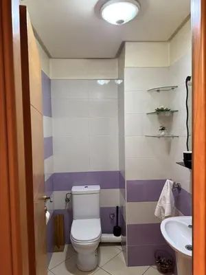 a bathroom with a toilet and a sink at Comfortable apartment in Casablanca Assalam in Casablanca
