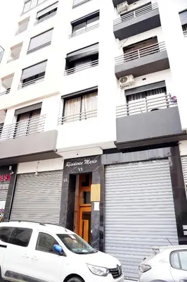 a white car parked in front of a building at Contemporary Moroccan elegance in the heart of Casa in Casablanca