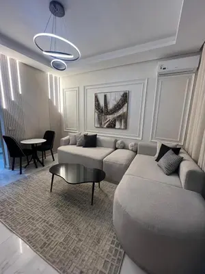 a living room with a couch and a table at Studio océan park in Casablanca