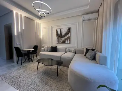 a living room with a couch and a table at Studio océan park in Casablanca
