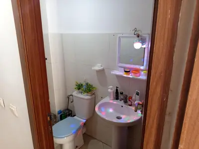 a small bathroom with a toilet and a sink at Téranga imm in Casablanca