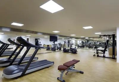 a gym with treadmills and elliptical machines at Domo Casablanca in Casablanca