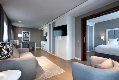 a living room with a bed and a couch and chairs at Domo Casablanca in Casablanca
