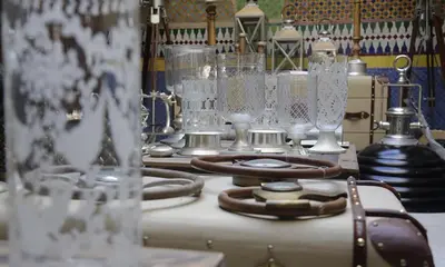 a bunch of glasses sitting on top of a table at Soundouss Hotel in Rabat