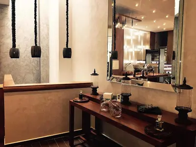 a restaurant with a counter with a mirror and a counter sidx sidx sidx at The Seven Hotel in Casablanca