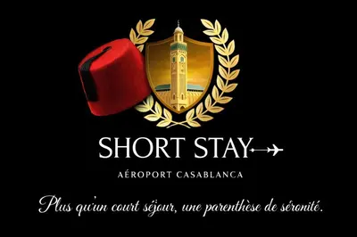 a picture of a crest with a red apple at Short Stay Apartment aéroport casablanca in Nouaseur