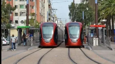 two red trains parked at a train station at Zitouna Rooms in Casablanca