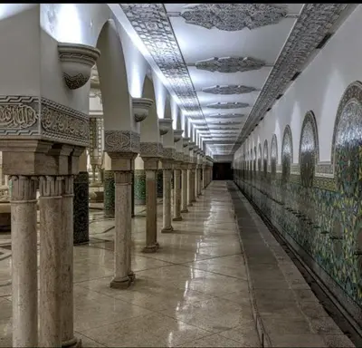 a hallway in a mosque with columns and mosaics at Zitouna Rooms in Casablanca