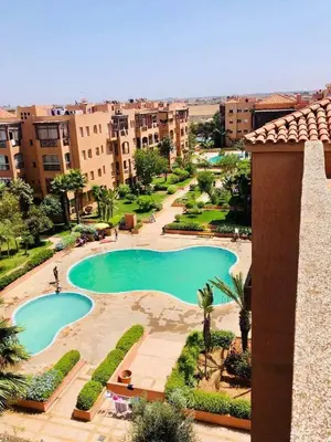 a view of a swimming pool in a resort at Un Havre de paix a Ricoflores in Mohammedia