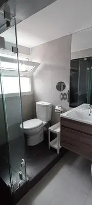 a bathroom with a toilet and a sink and a tub at Studios Taha in Rabat