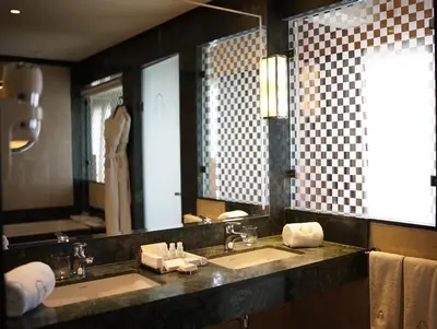 a bathroom with two sinks and a large mirror at Le Casablanca Hotel in Casablanca