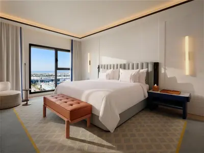 a bedroom with a large bed and a large window at The View Rabat in Rabat