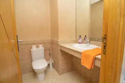 a bathroom with a toilet and a sink at Luxe & sérénité près de l Aireport Mohamed 5, votre Havre de Paix in Nouaseur
