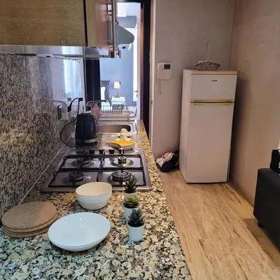 a kitchen with a stove and a counter top at Cozy Studio in Casablanca , 1 km from Casavoyageurs station , Free parking in Casablanca