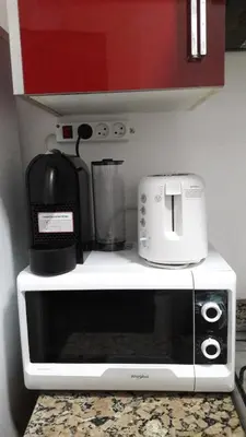 a microwave sitting on top of a kitchen counter at Horizon Home in Casablanca