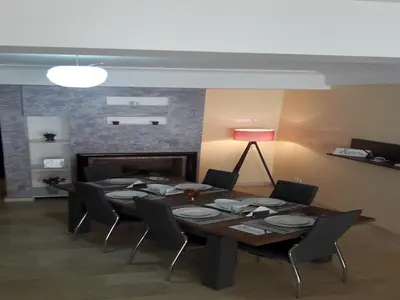 a dining room with a table and chairs and a fireplace at Horizon Home in Casablanca