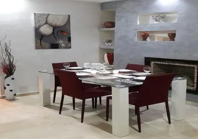 a dining room with a glass table and chairs at Horizon Home in Casablanca