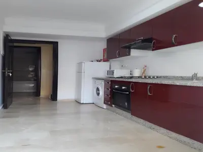a kitchen with a white refrigerator and a dishwasher at Horizon Home in Casablanca