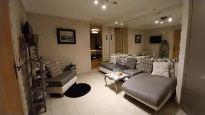 a living room with a couch and a table at Studio les Belles Residences in Casablanca
