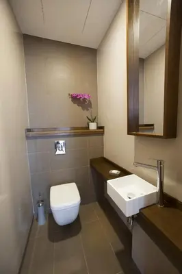 a bathroom with a toilet and a sink at Ocean Park Hotel, Premium Suites & Wellness in Casablanca
