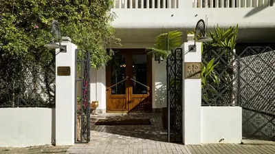 an entrance to a house with a wooden door at Hôtel particulier Le DOGE - Relais & Châteaux in Casablanca