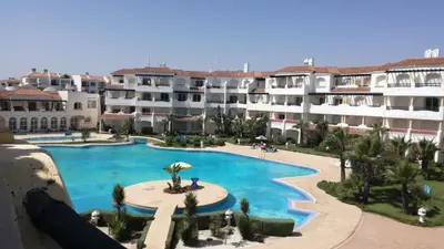 an aerial view of a swimming pool in a resort at Garden Beach Sidi Rahal in Sidi Rahal