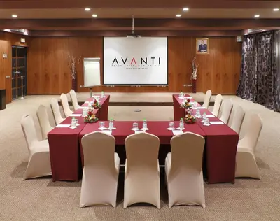 a conference room with a long table and chairs at Avanti Mohammedia Hotel in Mohammedia