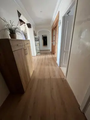 a hallway of a home with a wooden floor at Appartement Casablanca Garden Beach in Casablanca