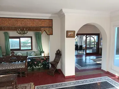 a living room with a couch and a table at Villa meublée face à la mer, Golf et Verdure in El Jadida