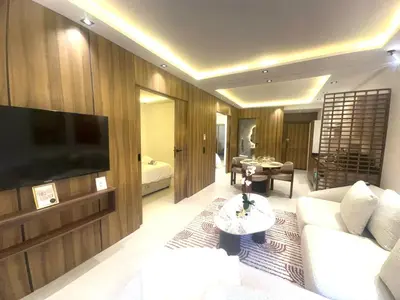 a living room with a couch and a tv at Calm&cosy appart very well located in Casablanca