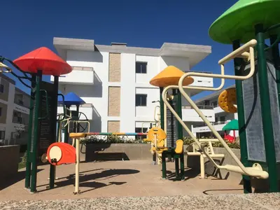a playground in front of a building at Marbella Beach location pour famille 2 chambres in Mansouria