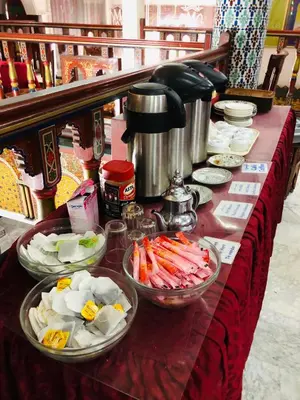 a buffet with bowls of food on a table at Hotel Moroccan House Casablanca in Casablanca
