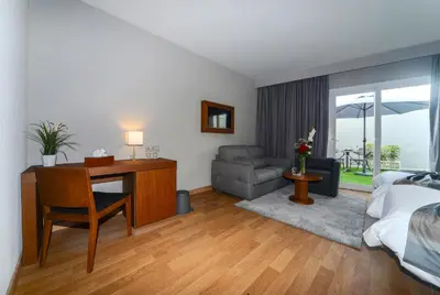 a bedroom with a desk and a bed and a couch at Golden Star Casablanca in Casablanca