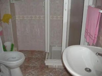 a bathroom with a toilet and a shower and a sink at Appartement Palm Beach in Mohammedia