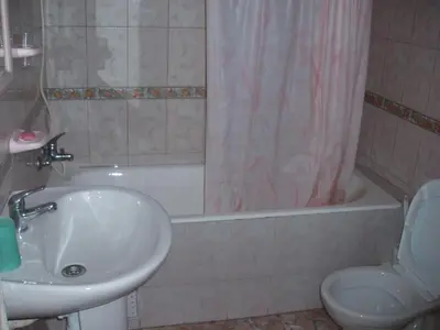 a bathroom with a sink and a toilet and a tub at Appartement Palm Beach in Mohammedia