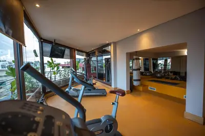 a gym with two exercise bikes in a room with windows at Gray Boutique Hotel Casablanca in Casablanca