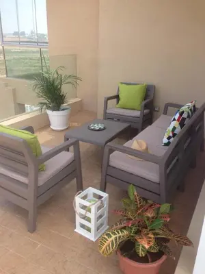a living room with two chairs and a coffee table at Résidence Evasion in Bouznika