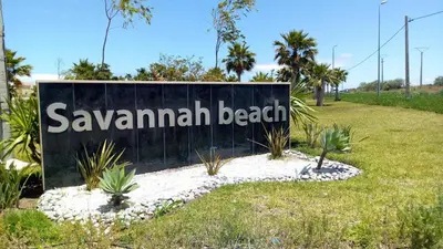 a sign for savannah beach in a park at Savannah Beach D11 in Sidi Rahal
