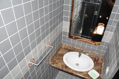 a bathroom with a sink and a mirror at Elegant Apartment with Balcony in Val Fleuri, Maarif Casablanca, Perfect for Family & Corporate Stays in Casablanca