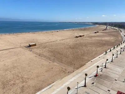 an overhead view of a beach with a row of lights at Appartement Cosy - Corniche plage Mohammedia in Mohammedia