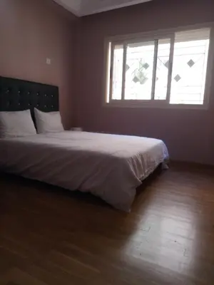 a bedroom with a large bed with a window at Apartment with Terrace in Casablanca