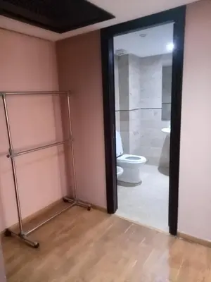 a bathroom with a toilet and a glass door at Apartment with Terrace in Casablanca
